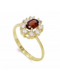 18K SORTIJA ORO AMARILLO CUAJO GRANATE 7X5 MM Y CIRCONITAS.
